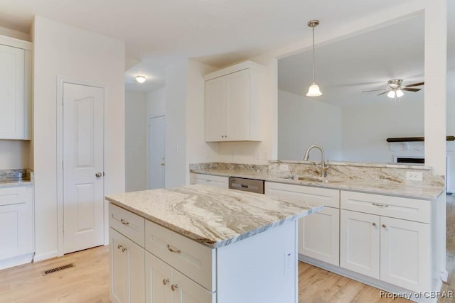 106 Haymaker Pl, Williamsburg, VA 23185 - kitchen featuring light wood-type flooring, a sink, white cabinetry, and a ceiling fan