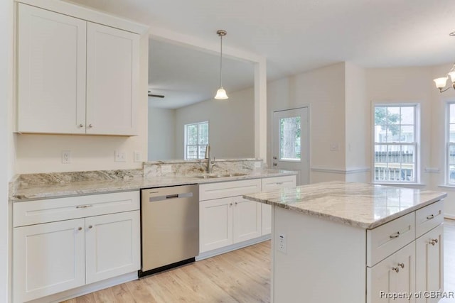 106 Haymaker Pl, Williamsburg, VA 23185 - kitchen featuring dishwasher, a sink, light wood finished floors, white cabinets, and hanging light fixtures