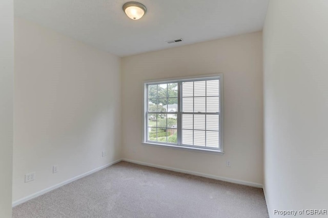 106 Haymaker Pl, Williamsburg, VA 23185 - spare room featuring light carpet and baseboards