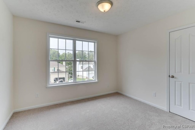 106 Haymaker Pl, Williamsburg, VA 23185 - unfurnished room with carpet flooring, baseboards, and a textured ceiling