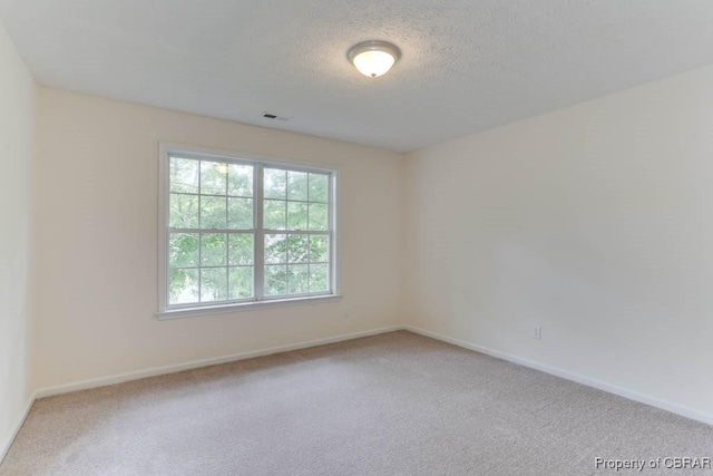 106 Haymaker Pl, Williamsburg, VA 23185 - unfurnished room featuring carpet flooring, baseboards, and a textured ceiling