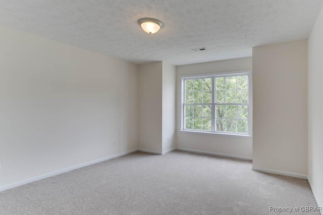 106 Haymaker Pl, Williamsburg, VA 23185 - spare room with carpet floors, a textured ceiling, and baseboards