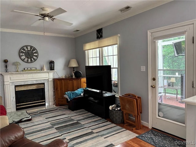 15023 Manor Gate Ct, Midlothian, VA 23112 - living room with crown molding, ceiling fan, a premium fireplace, baseboards, and wood finished floors