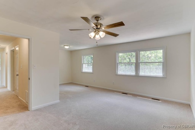 205 Captains Ct, Hampton, VA 23669 - spare room with light carpet, ceiling fan, and baseboards