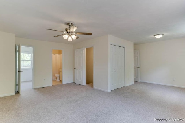205 Captains Ct, Hampton, VA 23669 - unfurnished bedroom featuring light colored carpet, baseboards, ensuite bath, ceiling fan, and a closet