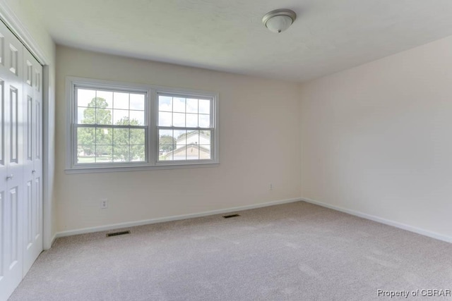 205 Captains Ct, Hampton, VA 23669 - unfurnished bedroom featuring carpet, baseboards, and a closet