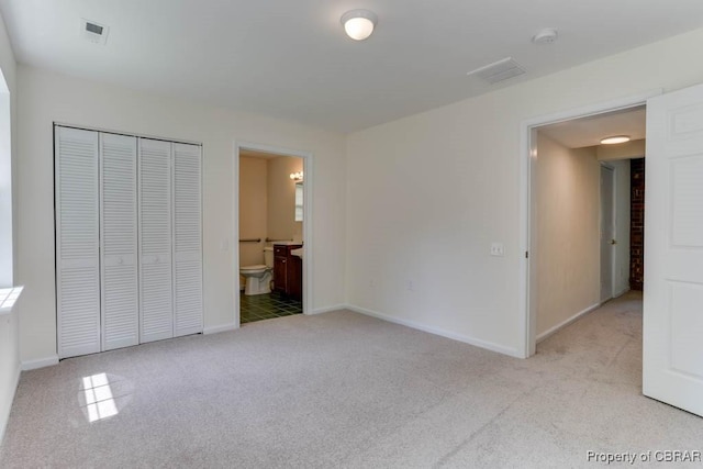 205 Captains Ct, Hampton, VA 23669 - unfurnished bedroom with light carpet, baseboards, a closet, and connected bathroom