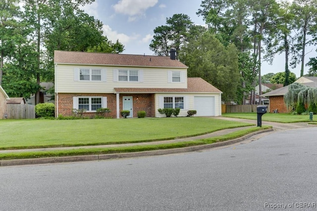 205 Captains Ct, Hampton, VA 23669 - view of front facade with an attached garage, brick siding, driveway, and a chimney