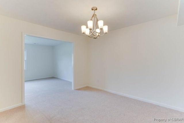 205 Captains Ct, Hampton, VA 23669 - unfurnished room featuring light colored carpet, a chandelier, and baseboards