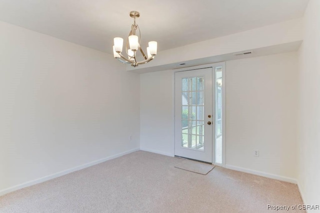 205 Captains Ct, Hampton, VA 23669 - unfurnished room featuring light carpet, a chandelier, and baseboards