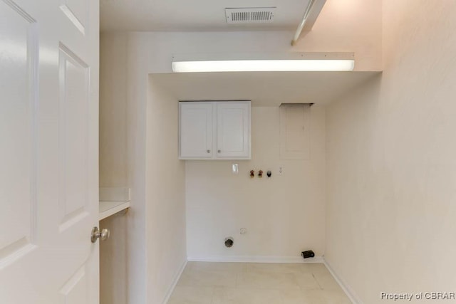 205 Captains Ct, Hampton, VA 23669 - laundry area featuring gas dryer hookup, cabinet space, washer hookup, light tile patterned floors, and baseboards