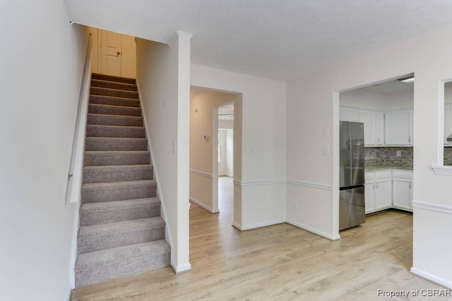 1603 Skiffes Creek Cir, Williamsburg, VA 23185 - staircase featuring wood finished floors and baseboards