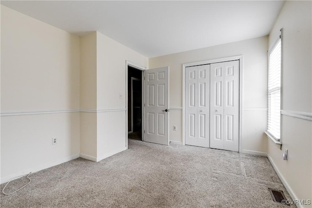 12321 Boxford Ln, Chesterfield, VA 23114 - unfurnished bedroom with carpet floors, a closet, and baseboards