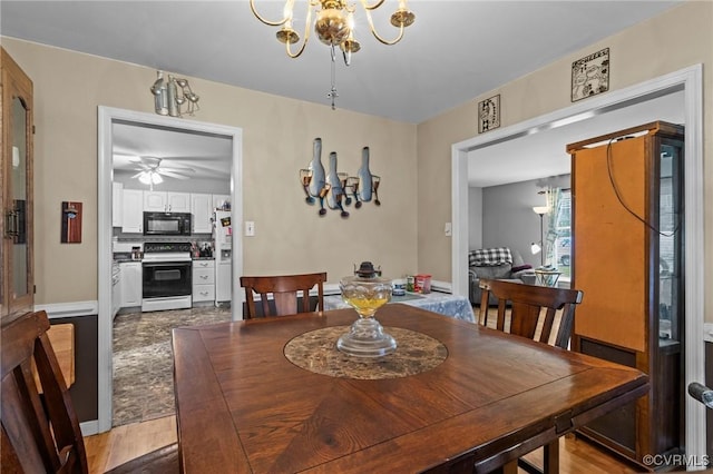 9540 Alfaree Rd, Chesterfield, VA 23237 - dining room featuring a chandelier, ceiling fan, and wood finished floors