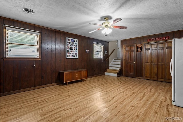 9540 Alfaree Rd, Chesterfield, VA 23237 - entrance foyer with healthy amount of natural light, wooden walls, light wood-type flooring, ceiling fan, and a textured ceiling