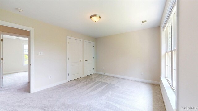 11706 Black Alder Dr, Moseley, VA 23120 - unfurnished bedroom with light carpet and baseboards