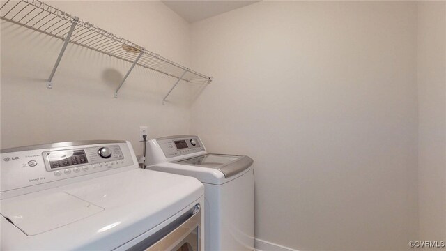 11706 Black Alder Dr, Moseley, VA 23120 - laundry area featuring washer and dryer and baseboards
