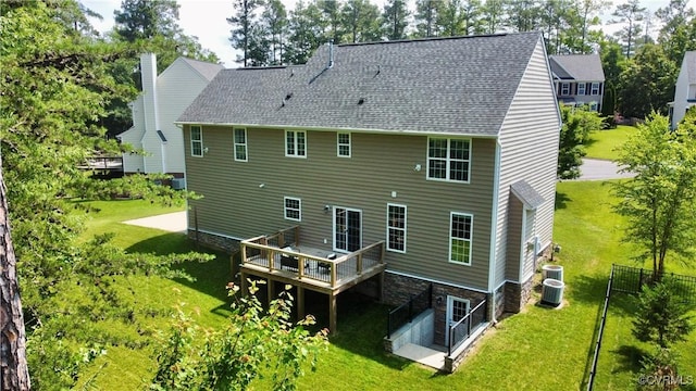 11706 Black Alder Dr, Moseley, VA 23120 - rear view of house featuring a deck, a lawn, central AC, and a shingled roof