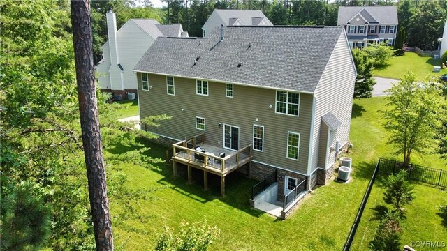 11706 Black Alder Dr, Moseley, VA 23120 - back of property featuring a wooden deck, central AC, roof with shingles, and view of wooded area