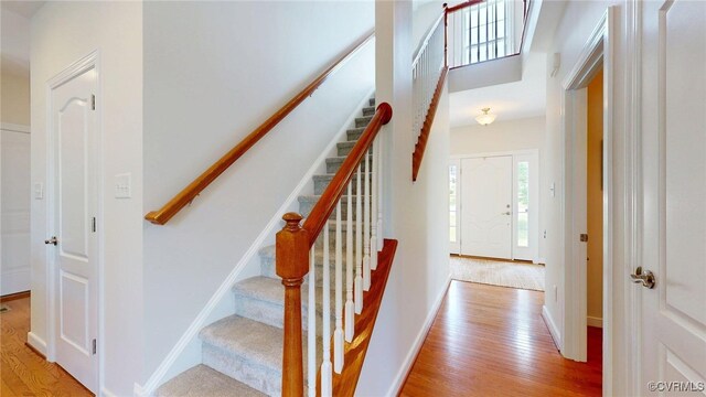 11706 Black Alder Dr, Moseley, VA 23120 - stairs with wood finished floors and baseboards