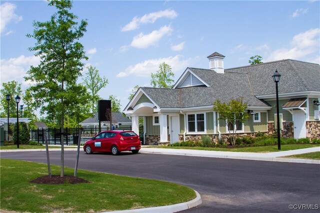11706 Black Alder Dr, Moseley, VA 23120 - view of front of property featuring roof with shingles and stone siding