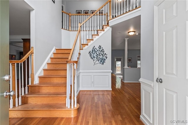 8940 Kings Charter Dr, Hanover, VA 23116 - staircase featuring wood finished floors and a high ceiling