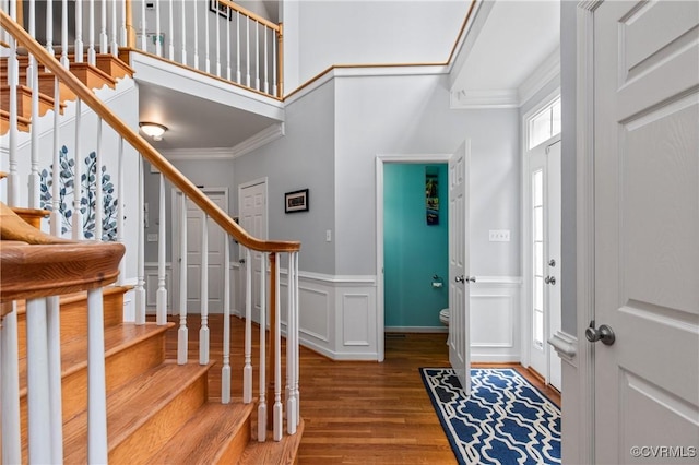 8940 Kings Charter Dr, Hanover, VA 23116 - foyer entrance with stairway, ornamental molding, wood finished floors, a wainscoted wall, and a towering ceiling