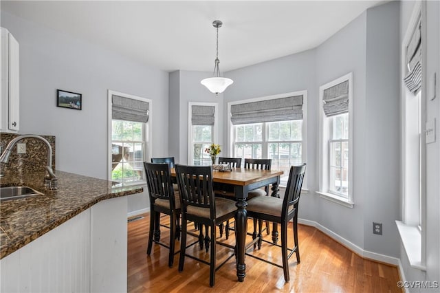 8940 Kings Charter Dr, Hanover, VA 23116 - dining space with healthy amount of natural light and light wood-style flooring
