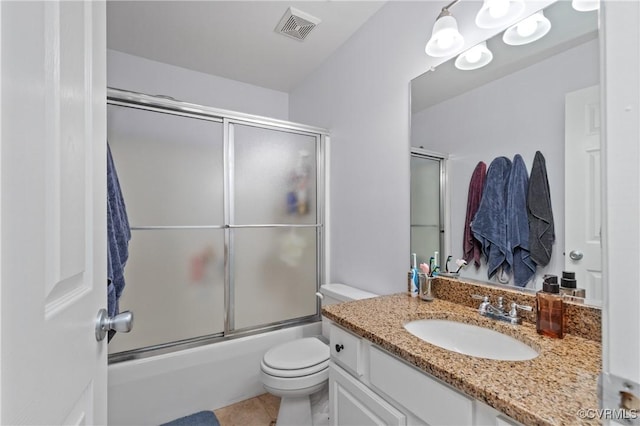 8940 Kings Charter Dr, Hanover, VA 23116 - full bathroom featuring vanity, shower / bath combination with glass door, and tile patterned floors
