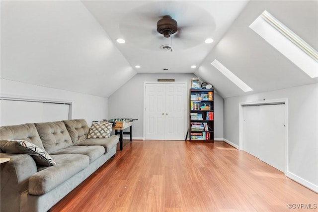 8940 Kings Charter Dr, Hanover, VA 23116 - living area with a skylight, light wood-style flooring, lofted ceiling, and recessed lighting