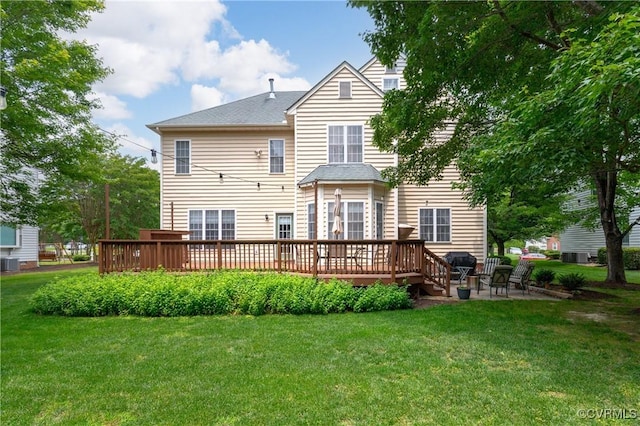 8940 Kings Charter Dr, Hanover, VA 23116 - back of property with a wooden deck, a yard, and a patio area