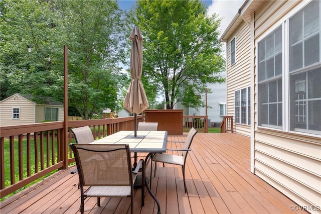 8940 Kings Charter Dr, Hanover, VA 23116 - wooden terrace with outdoor dining area and a shed