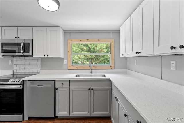 10780 Winchester Dr, Amelia Courthouse, VA 23002 - kitchen with appliances with stainless steel finishes, light countertops, gray cabinetry, and white cabinetry