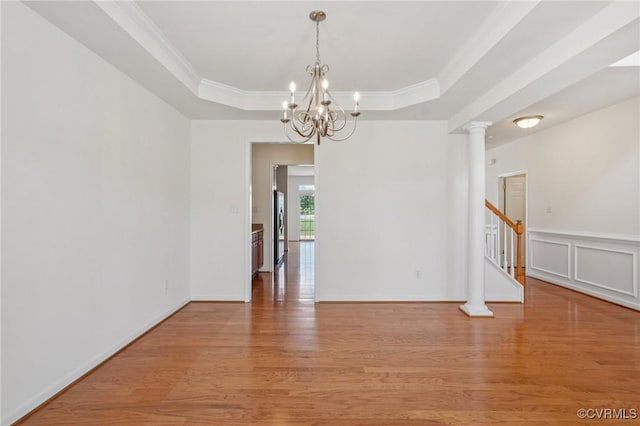 8156 Cool Summer Dr, Mechanicsville, VA 23111 - empty room with light wood-style flooring, a raised ceiling, crown molding, a chandelier, and stairway
