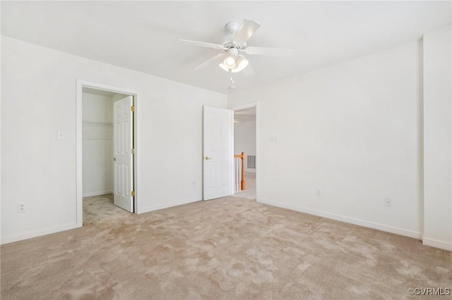 8156 Cool Summer Dr, Mechanicsville, VA 23111 - unfurnished bedroom featuring light carpet, a walk in closet, a ceiling fan, and a closet