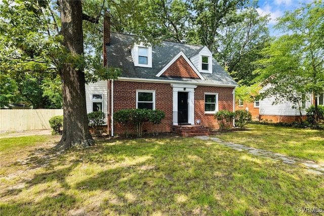 1020 E Belt Blvd, Richmond, VA 23224 - new england style home with brick siding and a chimney