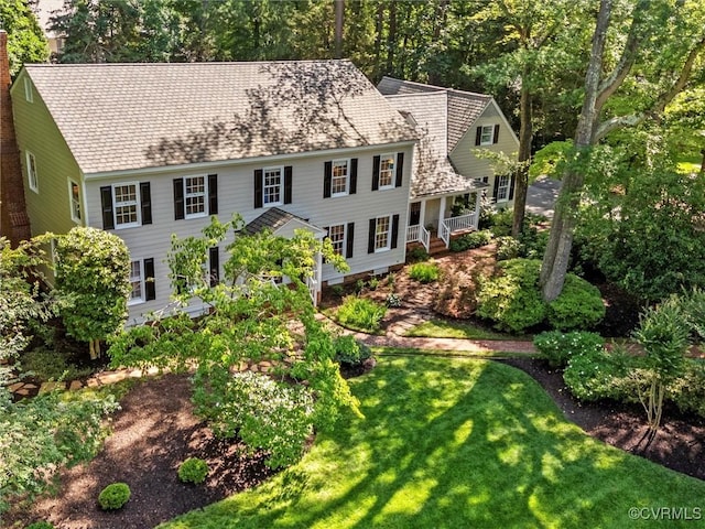 9606 Carterwood Rd, Henrico, VA 23229 - colonial inspired home with a front lawn and a chimney