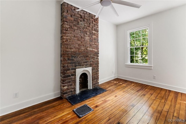 321 S Laurel St, Richmond, VA 23220 - unfurnished living room with hardwood / wood-style flooring, a ceiling fan, a fireplace, and baseboards