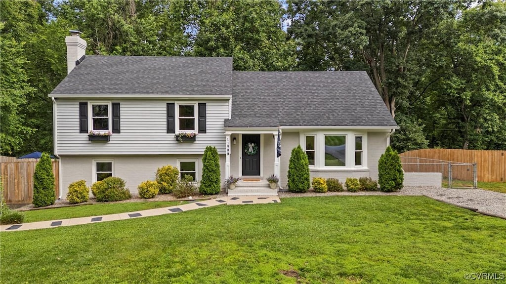 11900 Deerhurst Dr, Midlothian, VA 23113 - split level home featuring a chimney, a shingled roof, and view of scattered trees
