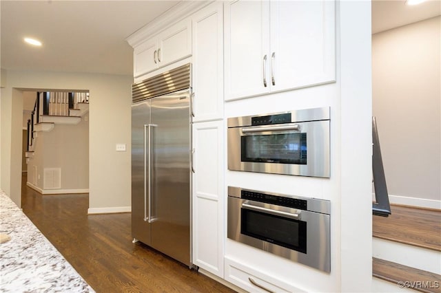14006 Riverdowns N Mews, Midlothian, VA 23113 - kitchen featuring appliances with stainless steel finishes, dark wood finished floors, white cabinetry, recessed lighting, and baseboards