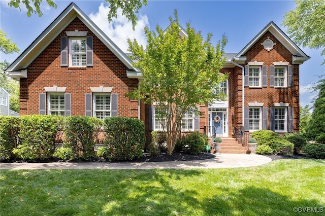 14006 Riverdowns N Mews, Midlothian, VA 23113 - georgian-style home featuring brick siding and a front yard