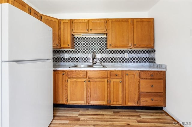 1312 St Michaels Ln, Richmond, VA 23229 - kitchen featuring freestanding refrigerator, light countertops, decorative backsplash, and light wood-type flooring