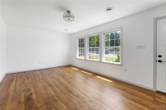 1312 St Michaels Ln, Richmond, VA 23229 - spare room featuring wood finished floors and baseboards