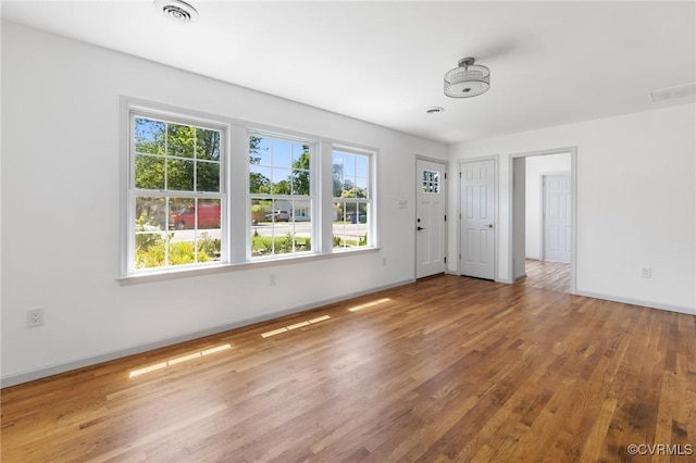 1312 St Michaels Ln, Richmond, VA 23229 - spare room featuring wood finished floors and baseboards