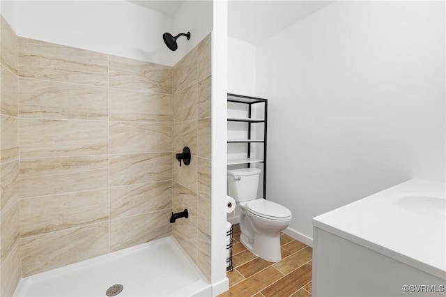 1312 St Michaels Ln, Richmond, VA 23229 - full bath with vanity, a tile shower, and wood finish floors