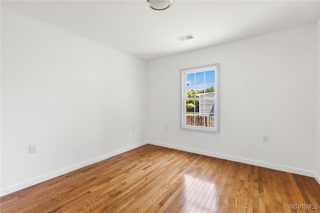 1312 St Michaels Ln, Richmond, VA 23229 - spare room featuring wood-type flooring and baseboards