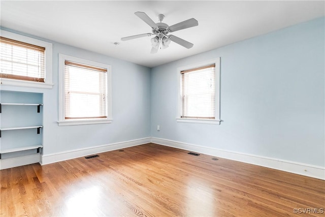 613 Roseneath Rd Unit U1, Richmond, VA 23221 - unfurnished room with healthy amount of natural light, wood finished floors, baseboards, and ceiling fan