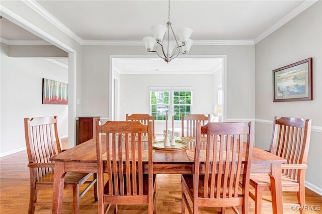 9951 Orchard Meadow Rd, Mechanicsville, VA 23116 - dining space featuring light wood finished floors, a chandelier, and crown molding