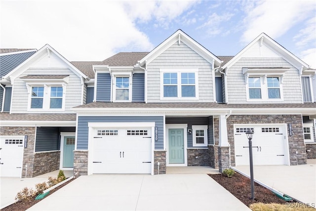 18751 Palisades Rdg, Moseley, VA 23120 - view of front of property featuring concrete driveway, an attached garage, and stone siding