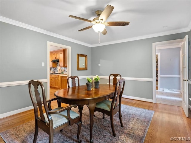 1125 Royal Ridge Rd, Chesterfield, VA 23114 - dining space with light wood-style floors, a ceiling fan, and crown molding